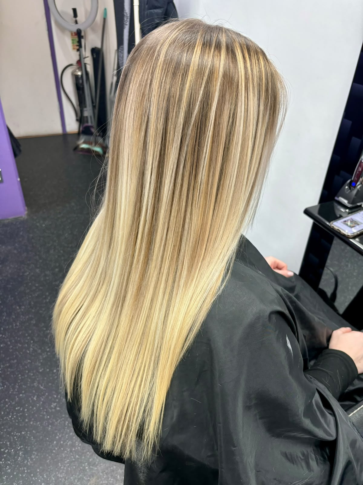 Long dimensional blonde hair with a smooth finish