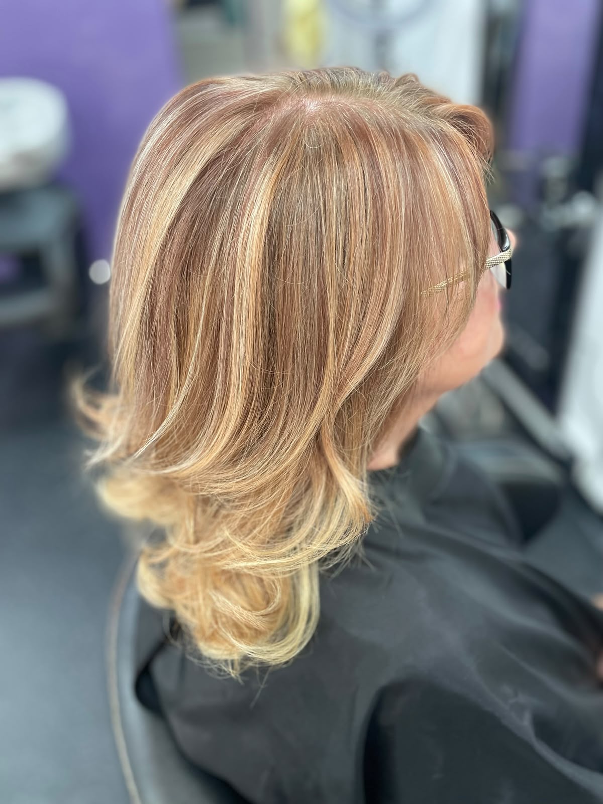Soft honey blonde layers with a polished finish