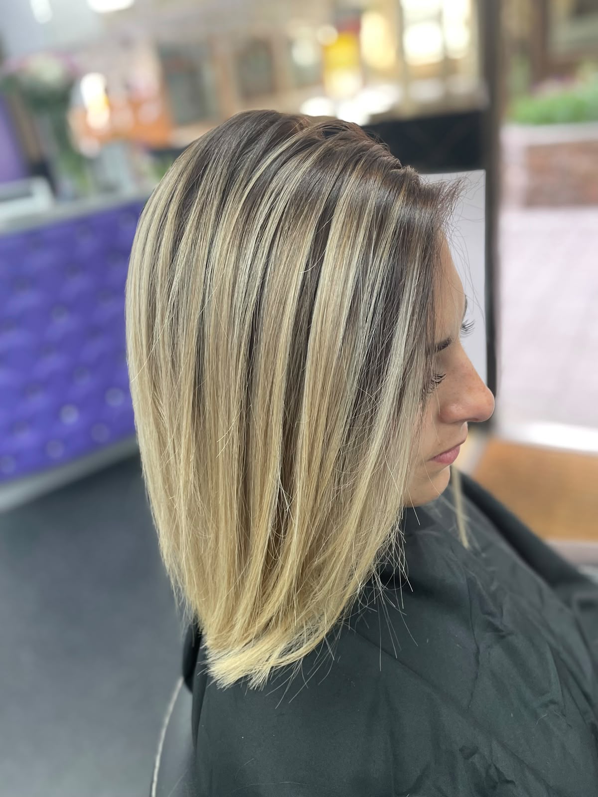 Blonde graduated cut with dimensional highlights